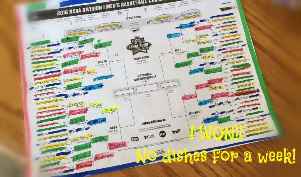 Picture of March Madness draft with two levels of results. Carolyn won! No dishes for a week!